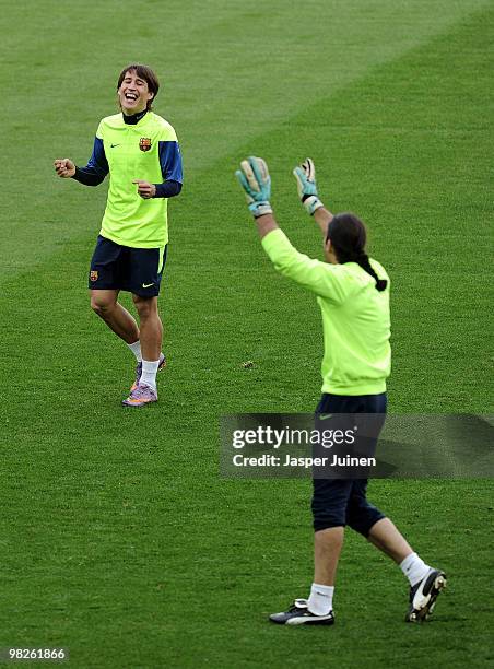 Bojan Krkic of Barcelona laughs as he jokes with second goalkeeper Jose Manuel Pinto during a training session ahead of their UEFA Champions League...