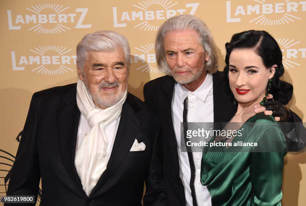 Lambertz manager Hermann Buehlbecker welcomes actor Mario Adorf and burlesque artist Dita Von Teese at the 'Lambertz Monday Night' event in Cologne,...