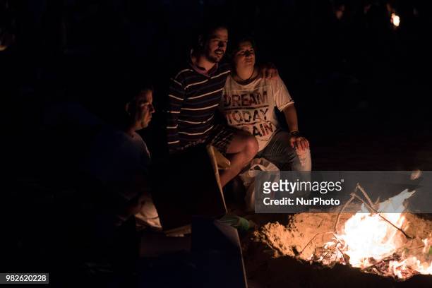 The tradition sends during the night of San Juan to make a bonfire in which the bad things of the year are burned, in the photo a group of people...