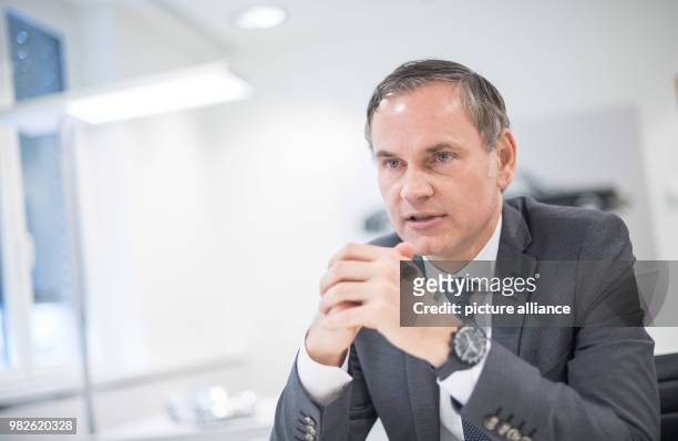 Oliver Blume, CEO of German automobile company Porsche, speaks in his office in Stuttgart, Germany, 29 January 2018. Photo: Sebastian Gollnow/dpa