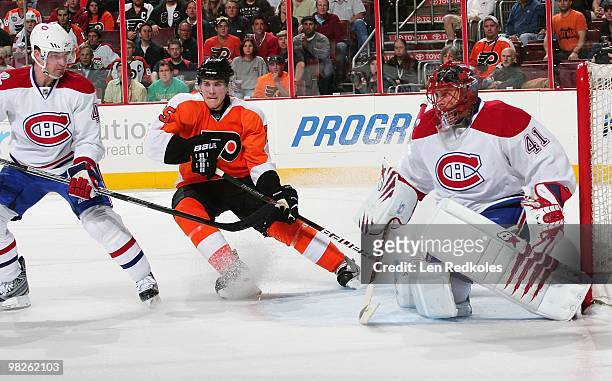 Matt Carle of the Philadelphia Flyers skates between Roman Hamrlik and Jaroslav Halak of the Montreal Canadiens on April 2, 2010 at the Wachovia...