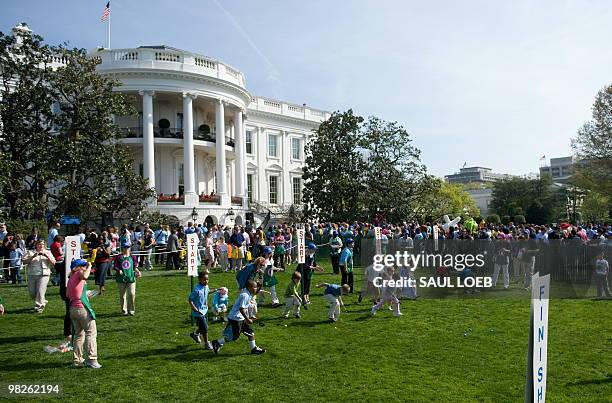 Guests attend the annual White House Easter Egg Roll, hosted by US President Barack Obama, on the South Lawn of the White House in Washington, DC,...