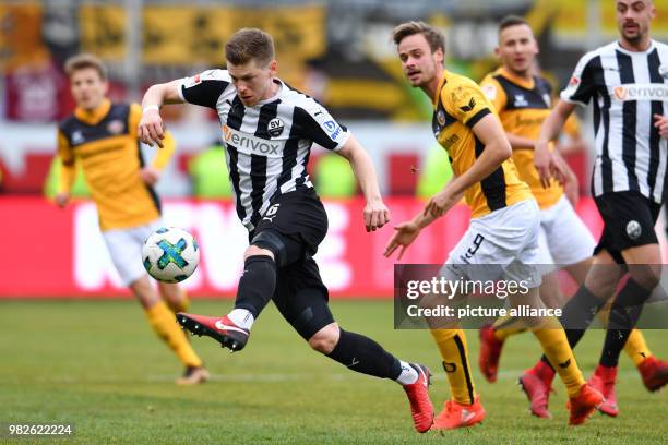 Sandhausen's Denis Linsmayer and Dresden's Lucas Roeser vie for the ball during the German 2nd Budesliga match between SV Sandhausen and Dynamo...