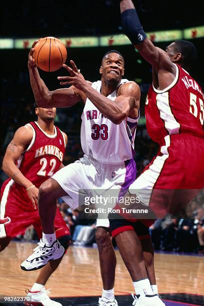 Antonio Davis of the Toronto Raptors shoots against the Atlanta Hawks during a game played in 2000 at the Air Canada Centre in Toronto, Canada. NOTE...