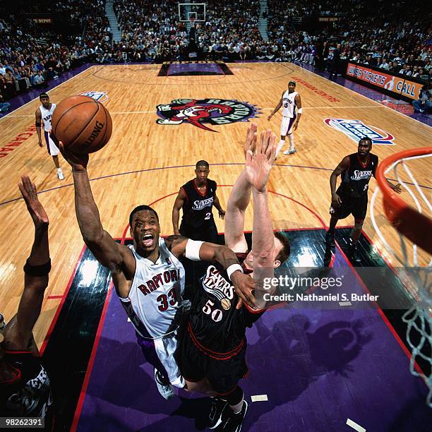 Antonio Davis of the Toronto Raptors dunks against the Philadelphia 76ers during a game played in 2001 at the Air Canada Centre in Toronto, Canada....