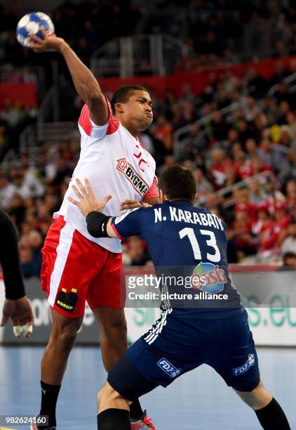 Denemark's Mads Mensah Larsen in action with France's Nikola Karabatic during the European Championship handball match for 3rd place, between France...