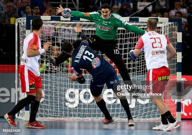 France's Nikola Karabatic throws at the goal of Denemark's goalie Yannick Green Krejberg during the European Championship handball match for 3rd...