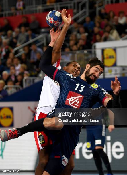 Denemark's Mads Mensah Larsen in action with France's Nikola Karabatic during the European Championship handball match for 3rd place, between France...