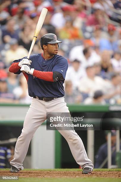 Darnell McDonald of the Boston Red Sox prepares to take a swing during a spring training baseball game against the Washington Nationals on April 3,...