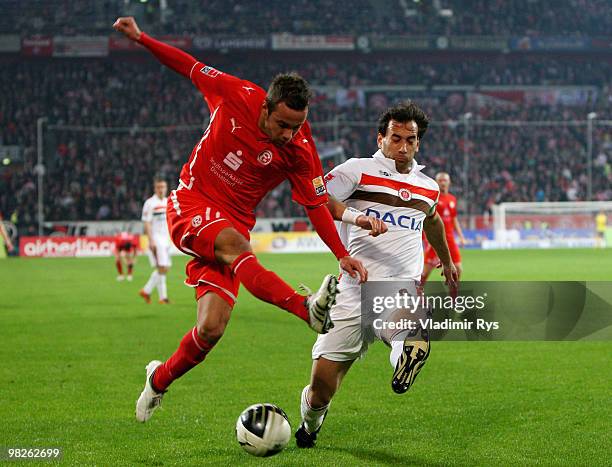 Sebastian Heidinger of Fortuna shoots as Fabio Morena of St. Pauli defends during the Second Bundesliga match between Fortuna Duesseldorf and FC St....