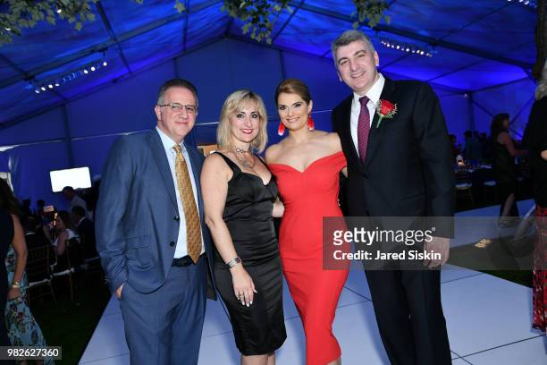 Guests, Yianna Tassiopoulos and Dr. Apostolos Tassiopoulos attend the 22nd Annual Hamptons Heart Ball on June 23, 2018 in Southampton, New York.