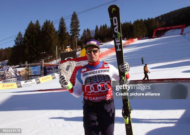 Winner Beat Feuz of Switzerland with his trophy after the men's downhill event at the Ski World Cup in Garmisch-Partenkirchen, Germany, 27 Janaury...