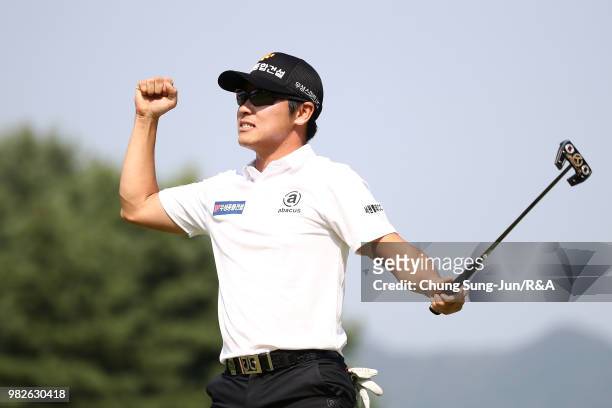 Choi Min-Chul of South Korea reacts after making his winning putt on the 18th hole during the final round of the Kolon Korea Open Golf Championship...