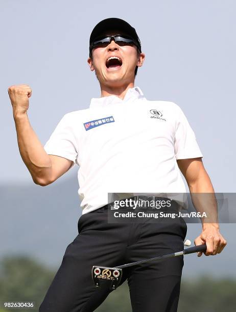 Choi Min-Chul of South Korea reacts after making his winning putt on the 18th hole during the final round of the Kolon Korea Open Golf Championship...