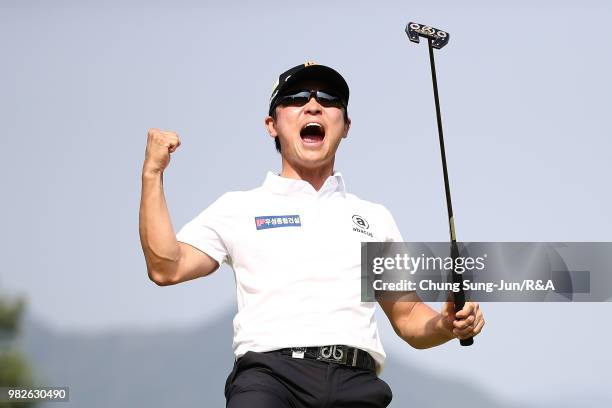 Choi Min-Chul of South Korea reacts after making his winning putt on the 18th hole during the final round of the Kolon Korea Open Golf Championship...