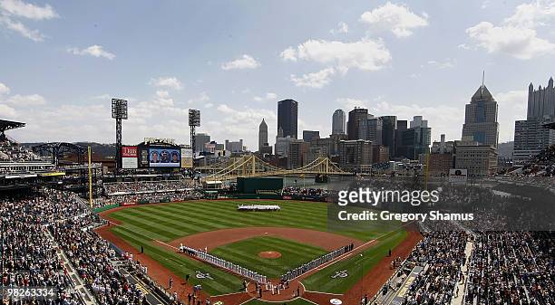 Players line the base paths of PNC Park during the National Anthem prior to the Pittsburgh Pirates playing the Los Angeles Dodgers in the Home Opener...