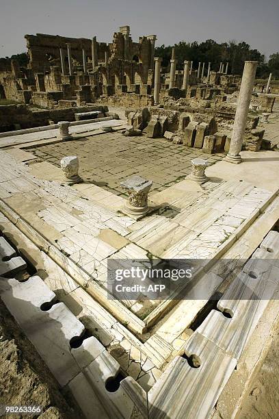 Partial view shows public toilets area at the Roman historical site of Leptis Magna, listed as World Heritage, in the Libyan coastal city of Lebda on...