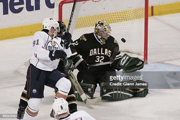 Kari Lehtonen of the Dallas Stars makes a save against Mike Comrie of the Edmonton Oilers on April 2, 2010 at the American Airlines Center in Dallas,...