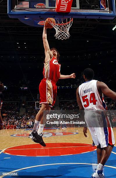 Anderson Varejao of the Cleveland Cavaliers dunks against Jason Maxiell of the Detroit Pistons during the game at the Palace of Auburn Hills on March...