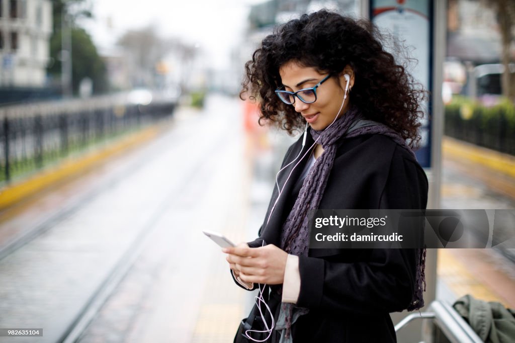 Woman waiting for train at the station