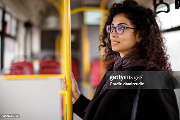 young woman traveling by bus - damircudic stock pictures, royalty-free photos & images