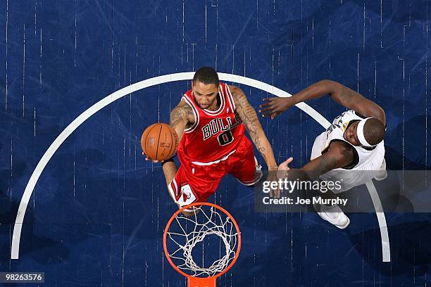 Acie Law of the Chicago Bulls shoots a layup against Zach Randolph of the Memphis Grizzlies during the game at the FedExForum on March 16, 2010 in...