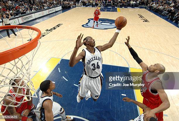 Hasheem Thabeet of the Memphis Grizzlies rebounds against Taj Gibson of the Chicago Bulls during the game at the FedExForum on March 16, 2010 in...