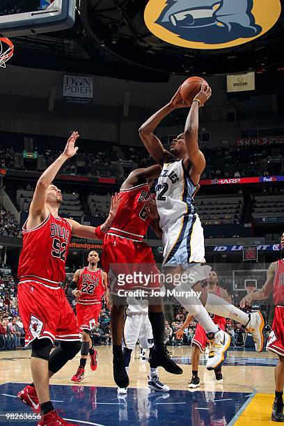 Rudy Gay of the Memphis Grizzlies goes up for a shot against Ronald Murray and Brad Miller of the Chicago Bulls during the game at the FedExForum on...