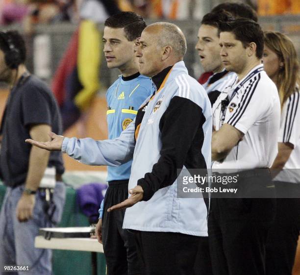 Head coach Dominic Kinnear of the Houston Dynamo gestures to the fourth official, Elias Bazakos, on the sidelines at Robertson Stadium on April 1,...