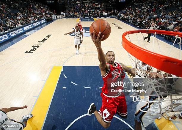 Acie Law of the Chicago Bulls shoots a layup against Zach Randolph of the Memphis Grizzlies during the game at the FedExForum on March 16, 2010 in...