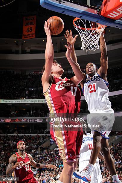 Anderson Varejao of the Cleveland Cavaliers shoots a layup against Thaddeus Young of the Philadelphia 76ers during the game at Wachovia Center on...