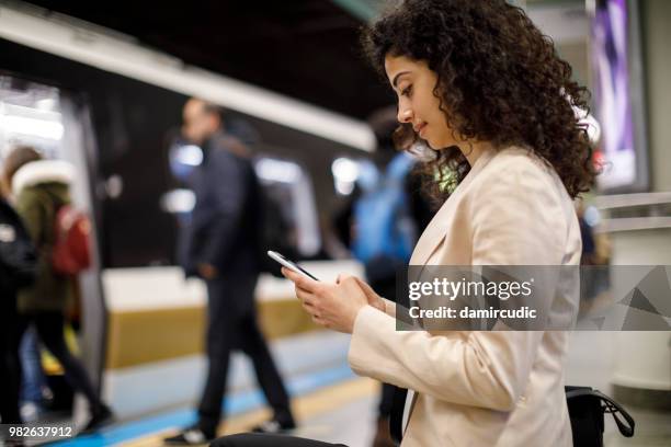 commuter at train station - damircudic stock pictures, royalty-free photos & images