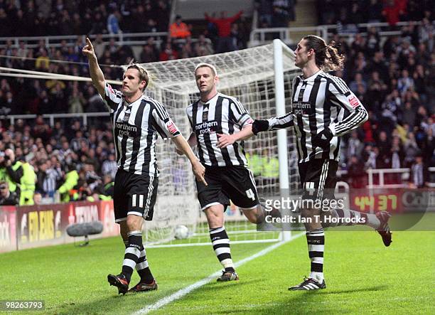 Peter Lovenkrands celebrates with Kevin Nolan and Andy Carroll after scoring from the penalty spot during the Coca Cola Championship match between...