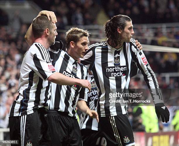 Peter Lovenkrands celebrates with Kevin Nolan and Andy Carroll after scoring from the penalty spot during the Coca Cola Championship match between...