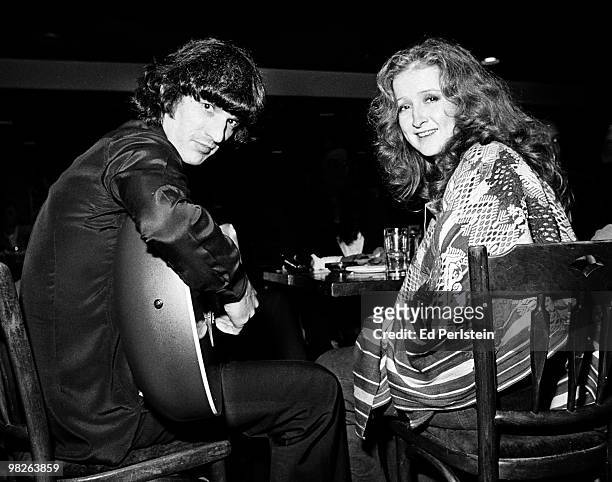 Rick Danko and Bonnie Raitt are seen backstage at the Old Waldorf club in December 1977 in San Francisco, California.