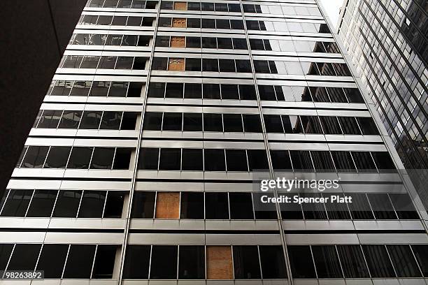 Partly empty office building with boarded up windows that is seeking renters is viewed in the financial district on April 5, 2010 in New York City....