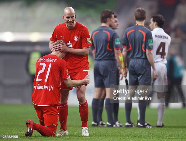 Johannes van den Bergh knies in front of his team mate Stephan Sieger of Fortuna to celebrate winning the Second Bundesliga match between Fortuna...