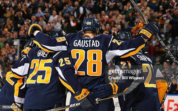 Paul Gaustad of the Buffalo Sabres celebrates a goal with teammates Michael Grier and Drew Stafford in a game against the Tampa Bay Lightning on...