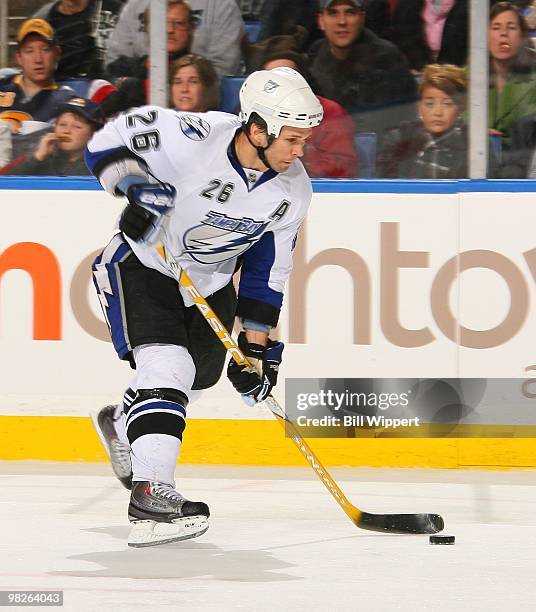Martin St. Louis of the Tampa Bay Lightning shoots the puck against the Buffalo Sabres on March 27, 2010 at HSBC Arena in Buffalo, New York.