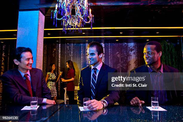 friends in nightclub bar hanging out - inti st clair stock pictures, royalty-free photos & images