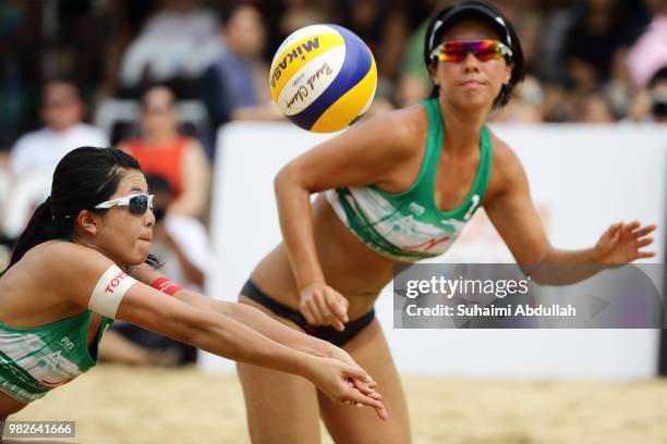 Takemi Nishibori and Ayumi Kusano of Japan in action during the main draw final 1st place women's match against Chiyo Suzuki and Reika Murakami of...