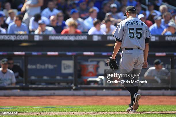 Josh Johnson of the Florida Marlins leaves the mound after being taken out of the game against the New York Mets during their Opening Day game at...