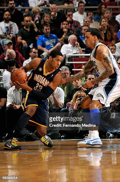 Danny Granger of the Indiana Pacers goes up against Matt Barnes of the Orlando Magic during the game on January 20, 2010 at Amway Arena in Orlando,...