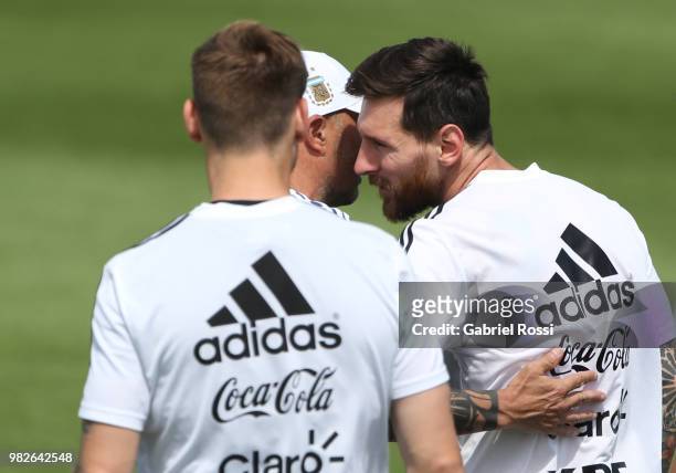 Jorge Sampaoli coach of Argentina acknowledges Lionel Messi of Argentina on his 31st birthday prior a training session at Stadium of Syroyezhkin...