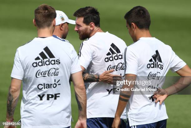 Jorge Sampaoli coach of Argentina acknowledges Lionel Messi of Argentina on his 31st birthday prior a training session at Stadium of Syroyezhkin...