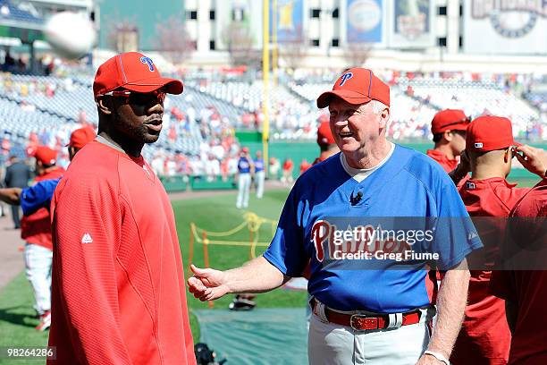 Manager Charlie Manuel and Ryan Howard of the Philadelphia Phillies talk before the game against the Washington Nationals on Opening Day at Nationals...