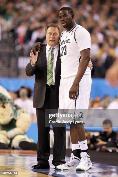 Head coach Tom Izzo of the Michigan State Spartans talks with Draymond Green from the sideline while taking on the Butler Bulldogs during the...