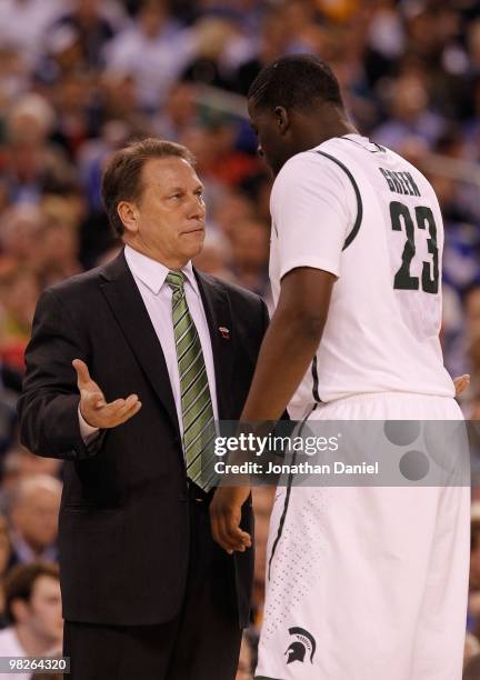 Head coach Tom Izzo of the Michigan State Spartans talks with Draymond Green from the sideline while taking on the Butler Bulldogs during the...