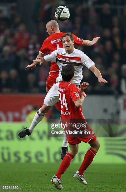 Matthias Lehmann of St. Pauli and Marco Christ of Fortuna jump for a header during the Second Bundesliga match between Fortuna Duesseldorf and FC St....
