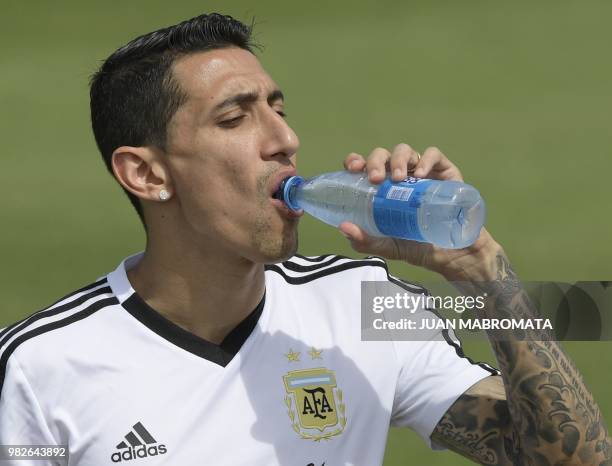 Argentina's midfielder Angel Di Maria drinks water during a training session at the team's base camp in Bronnitsy, near Moscow, Russia on June 24,...